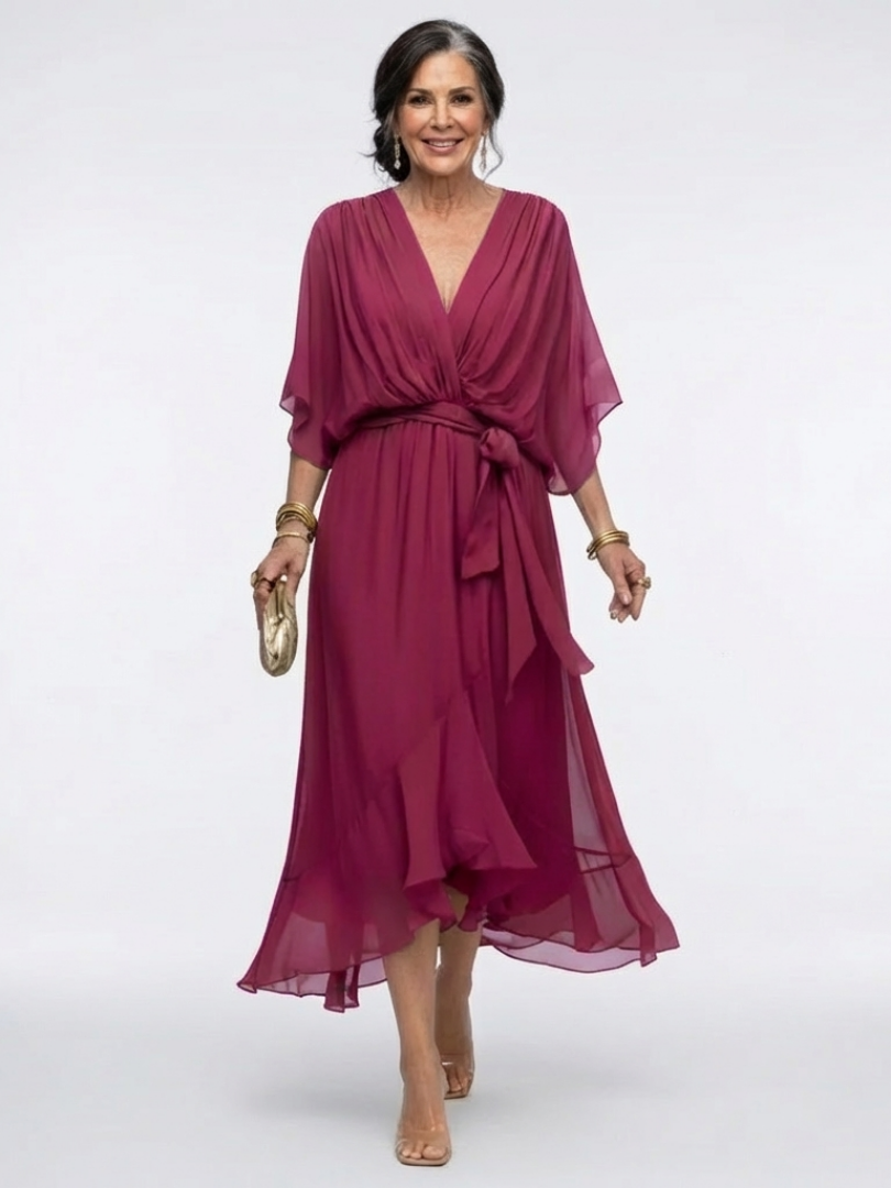 Vestido midi cruzado elegante con mangas kimono y lazada en la cintura
