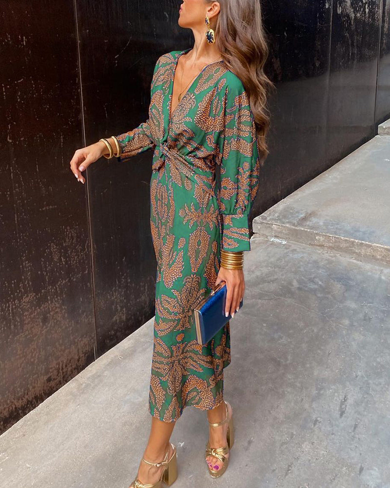 Vestido midi de manga larga con cintura anudada y estampado floral