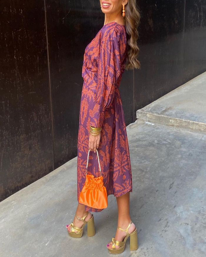 Vestido midi de manga larga con cintura anudada y estampado floral